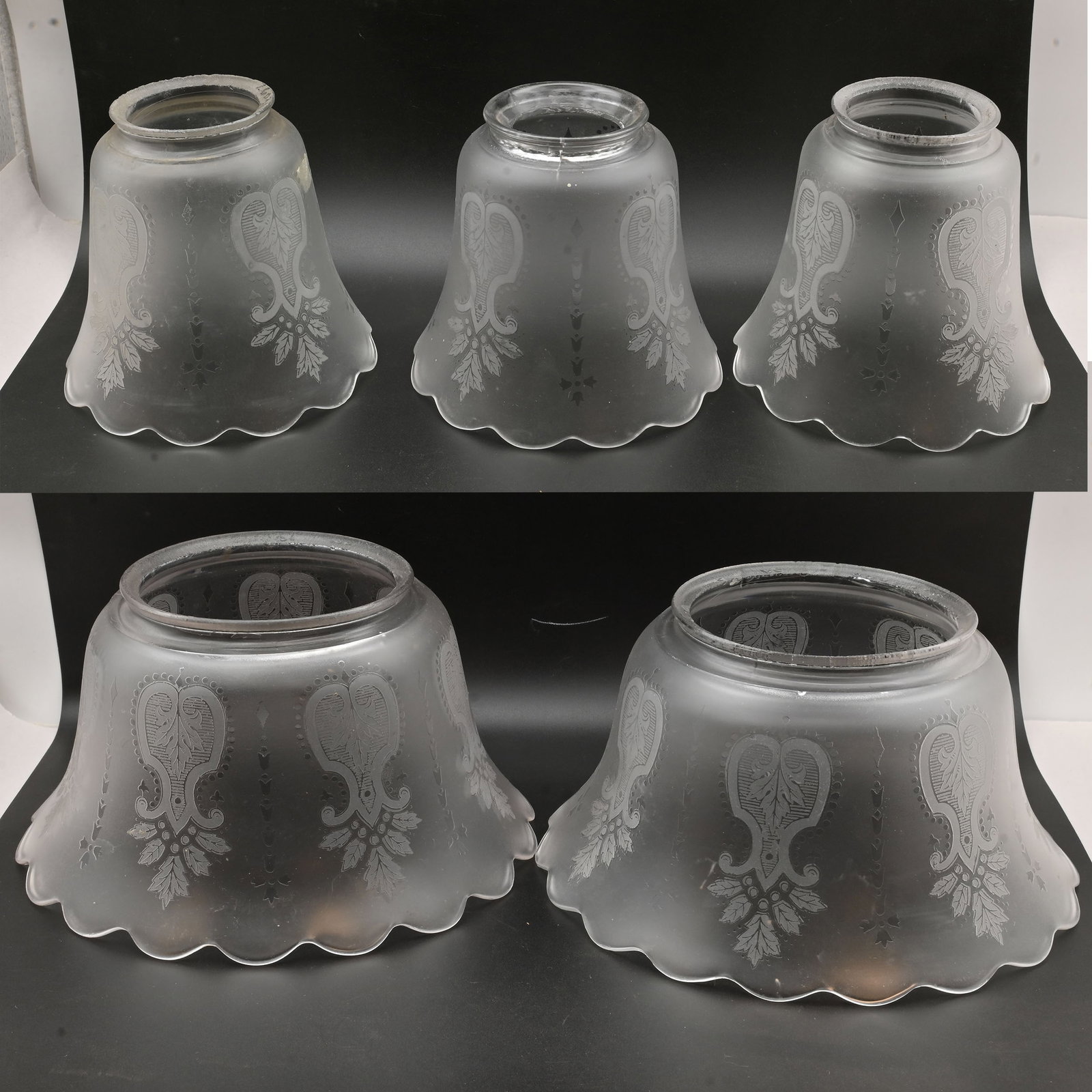 Matching set of five gas/electric glass etched shades: Matching set of five gas/electric glass etched shades. Condition: Age Consistent. Three are 2.25 inch fitters, two are 4 inch fitters. Smaller 2.25 inch fitter shades are 4 inches tall x 4.5 inches di