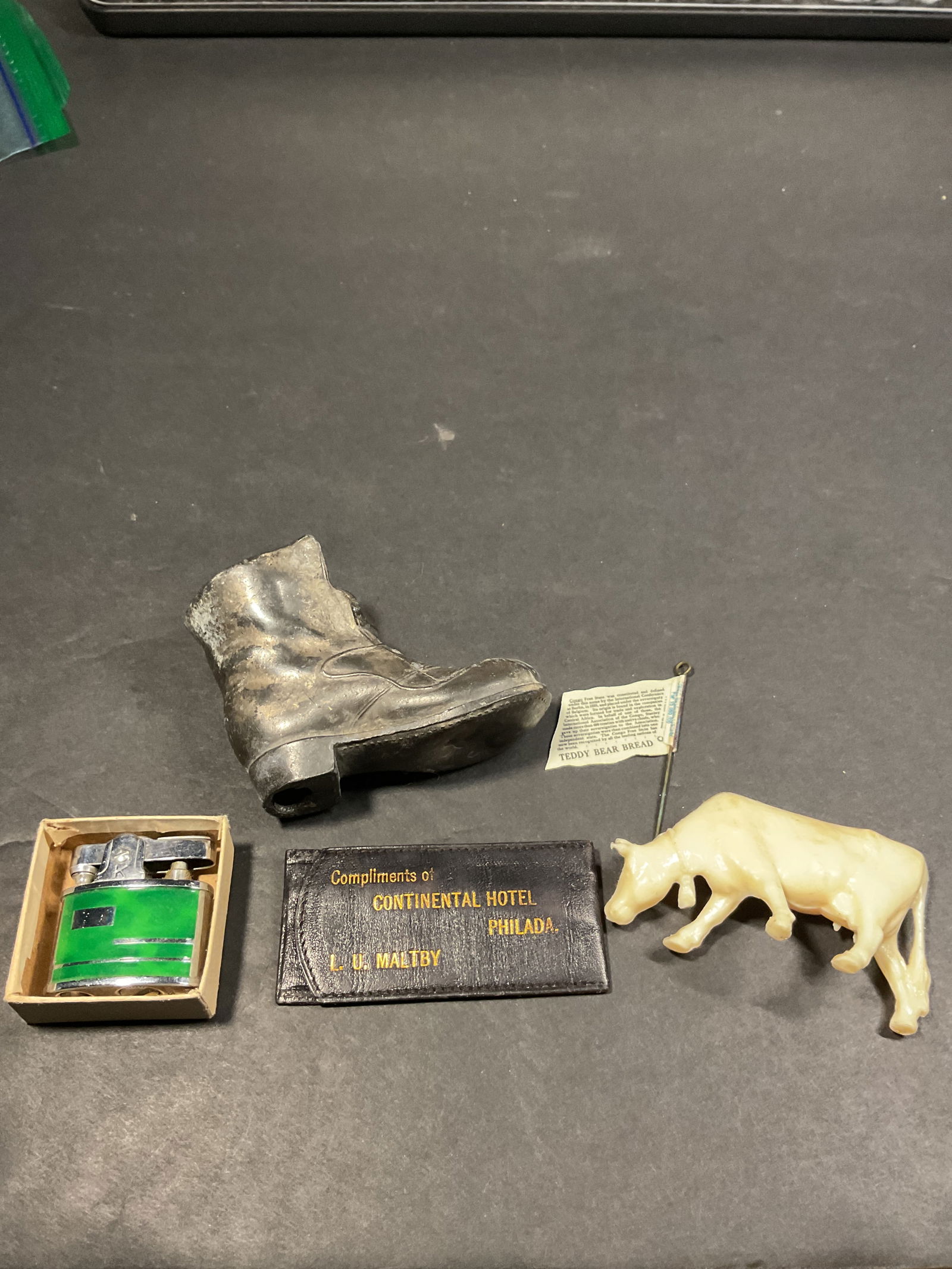 Interesting small lot: Teddy bear bread celluloid flag pin Japan lighterBoot matchsafe Continental hotel match holder Early cow figure