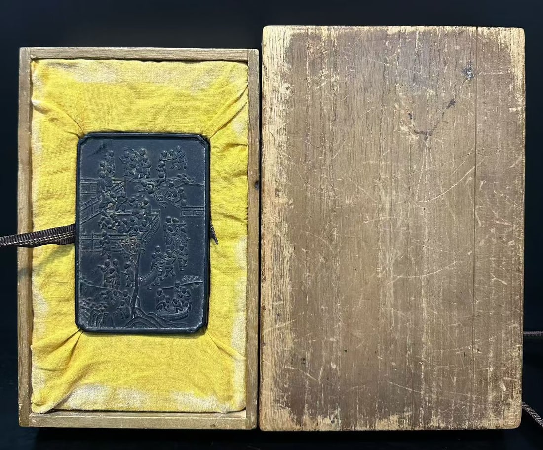 Qing Dynasty Ink Carving Hundred Sons Painting Ink Plaque with Wooden Box: Ink carved hundred-children ink plaque with wood box, rectangular ink plaque, relief of hundred-children celebrating spring, vivid figures, with yellow-silk wood box, fine and dense ink quality, schol