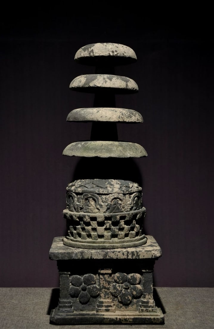 Before the Ming Dynasty, there were multiple layers of stone carved Buddhist pagodas: Stone carved multi-tiered Buddhist stupa, sandstone texture, multi-tiered chatra (umbrella) tiers, lotus and niche carved on base, openwork stupa body, with damage, simple and solemn, Buddhist ritual 