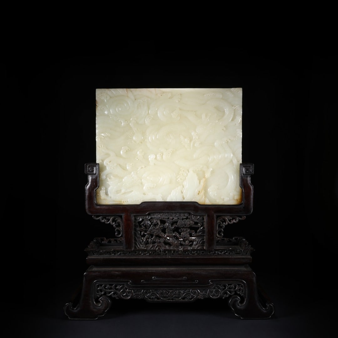 Qing Dynasty Blue and White Jade Carving Nine Dragon Opera Pearl Insertion Screen: Greenish-white jade nine-dragons-playing-pearl table screen, warm jade, nine-dragons-playing-pearl pattern in relief, vigorous dragon forms, with Hongmu carved stand, solemn and magnificent, fine furn