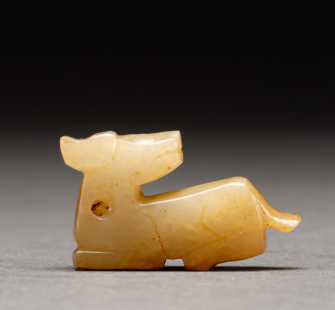 Before the Ming Dynasty, Hotan Jade was worn in the shape of an animal: Weathered jade beast-form pendant, weathered jade, beast reclining, concise body form, perforation for hanging. Height: 2cm, Width: 3.5cm, Weight: 12g.