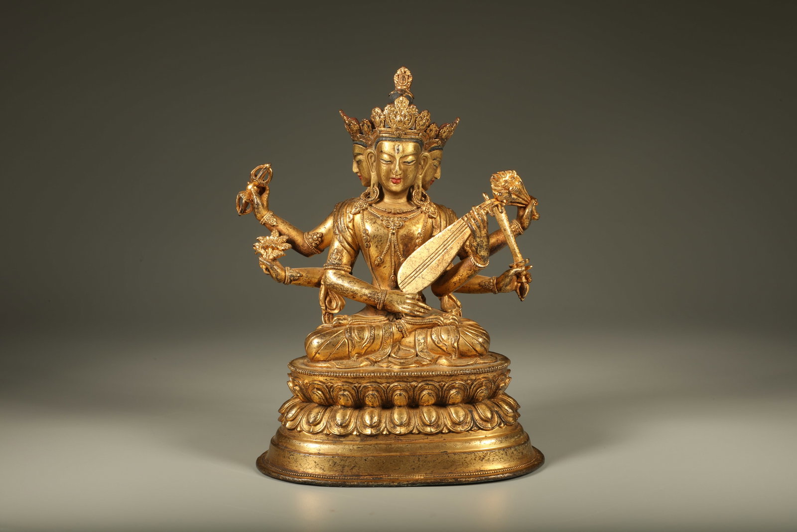 Qing Dynasty Bronze Gilded Four sided Six Armed Miaoyin Heavenly Maiden Statue: Gilt-bronze four-faced six-armed Saraswati (Miaoyin Tiannu) statue, fine casting, dignified face, fluent robe lines, full gilding, solemn and majestic appearance. Dimensions: Height: 16cm, Width: 11.2