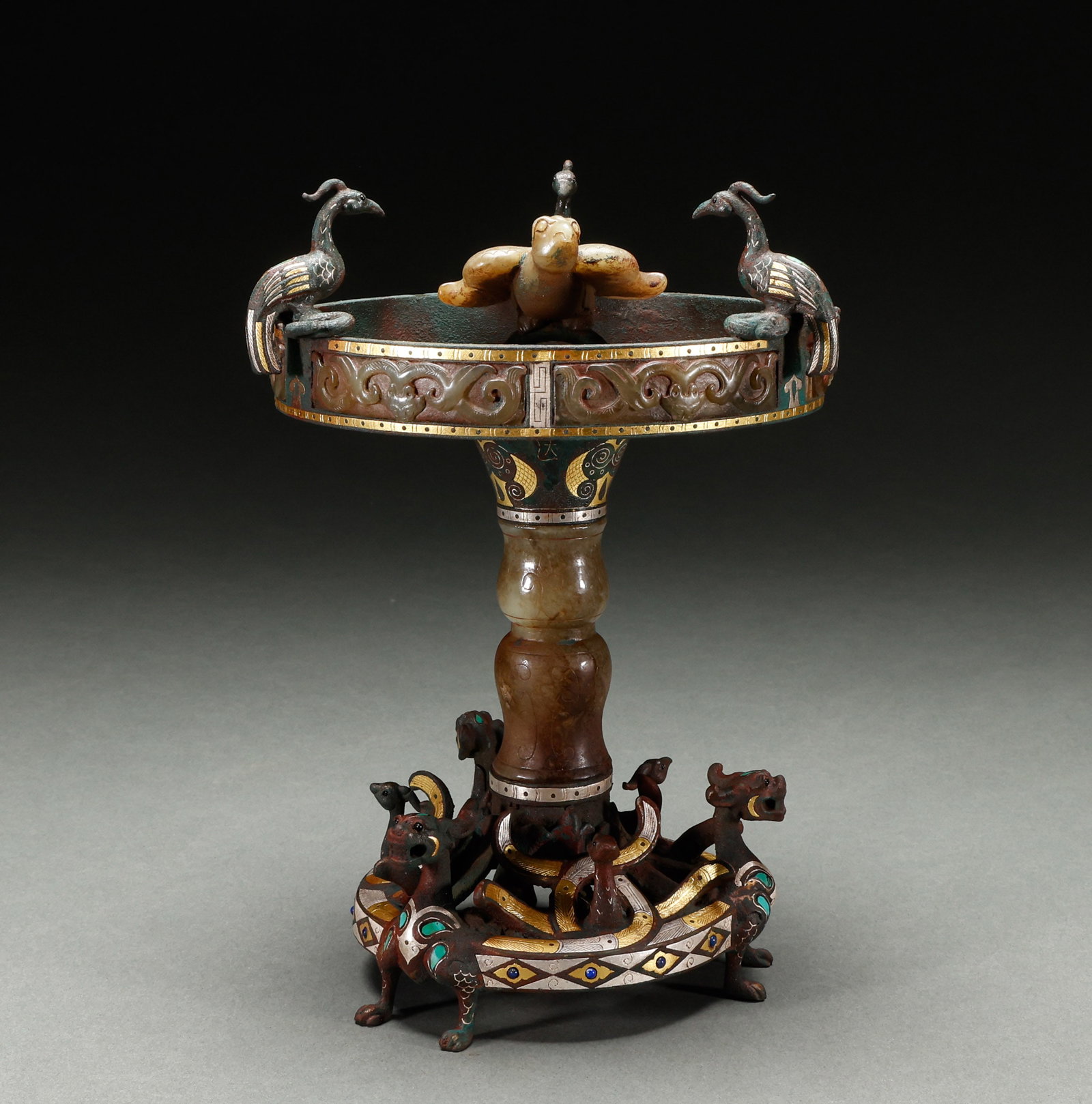 Before the Ming Dynasty, bronze inlaid with gold and silver inlaid with Hotan Jade ritual vessels: Pre-Ming Dynasty bronze gold-silver-inlaid Hetian jade-inlaid ritual vessel, refined bronze, exquisite gold-silver inlay craftsmanship, exquisite and dense pattern, fluent lines, dignified form. Heigh