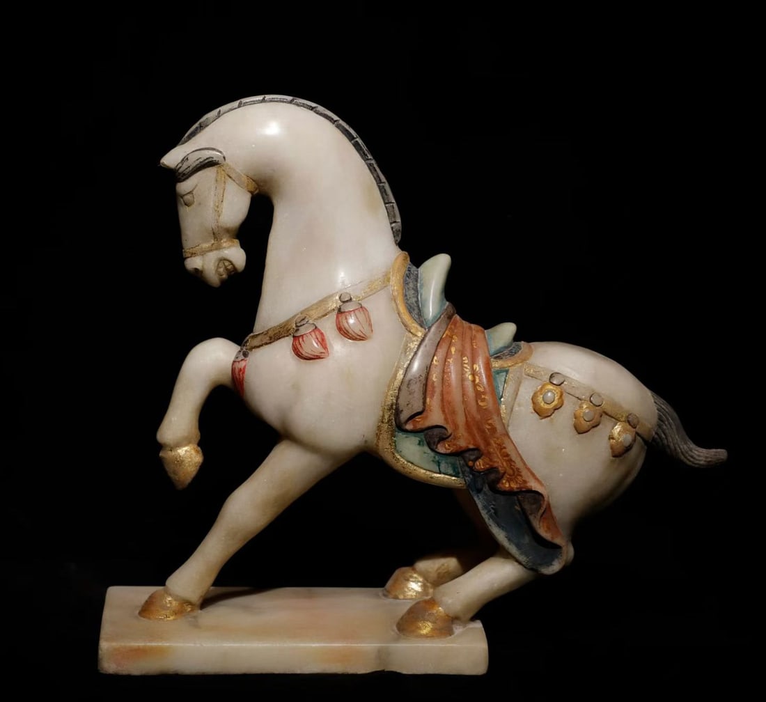 Before the Ming Dynasty, Han white jade horses: Pre-Ming Dynasty white marble horse, warm and fine jade-like stone, vivid form, fine carving, fluent lines, rich patina. Height: 30cm, Width: 40cm. A fine example of jade-carved animal.