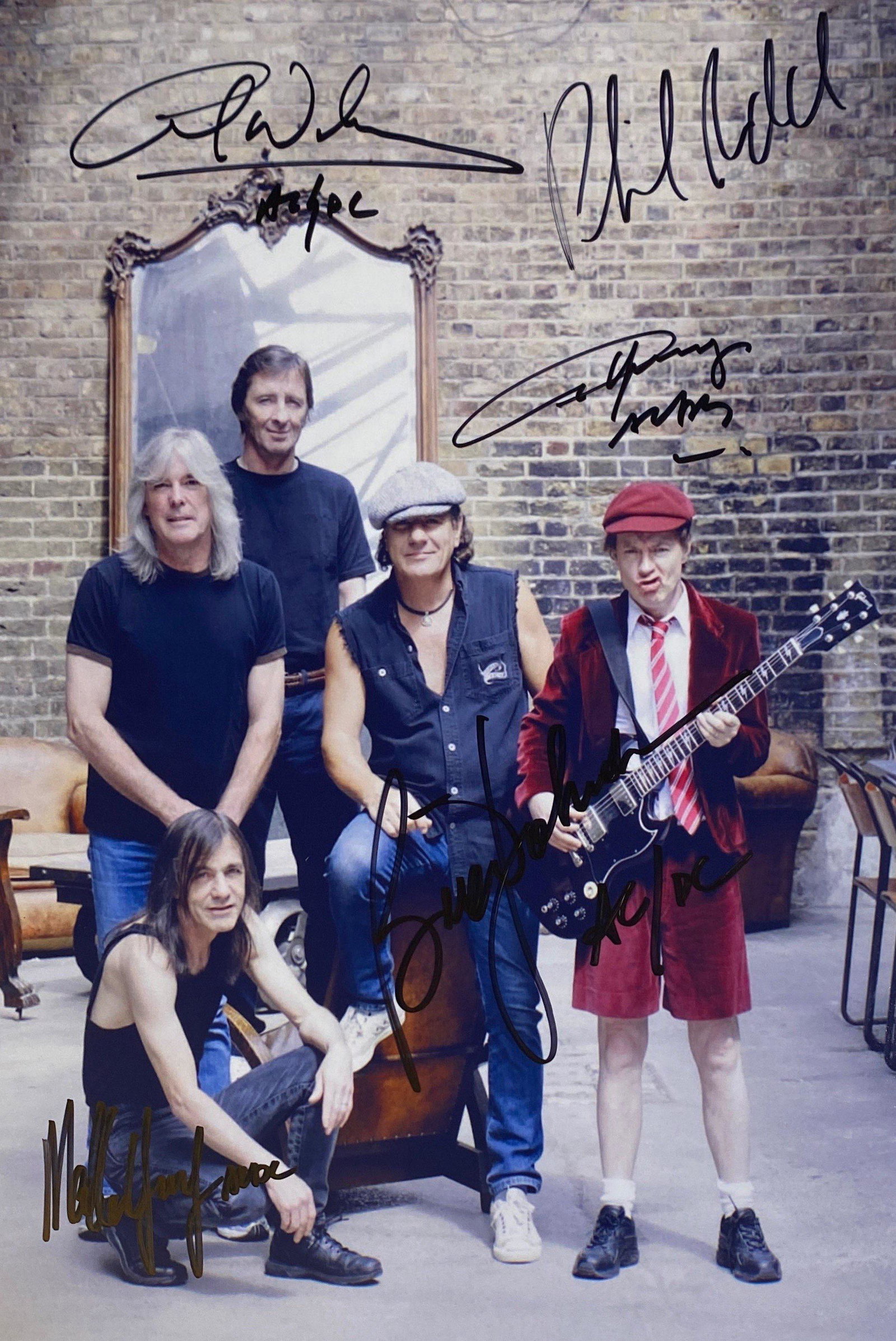Autograph ACDC Photo: Category: CollectiblesSize: 8 x 10Autograph: Angus Young, Malcolm Young, Phil Rudd, Brian Johnson, Cliff Williams