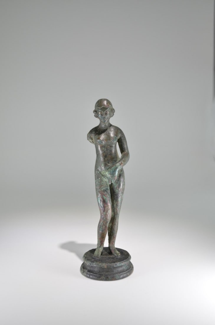 Venus Pudica.: Venus Pudica. Roman Imperial Period, 3rd quarter 2nd century AD. Solid cast. The nude goddess with inlayed eyes made of silver covering her pubic with her left hand. She is wearing a hairdress with mi