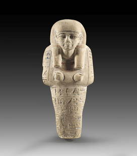 Uschebti des Amenhotep.: A limestone shabti of Amenhotep, Limestone with traces of color, H 20.5cm. New Kingdom. 18th dynasty, time of Thutmosis IV, 1397 - 1388 BC. Mummy-shaped with a tripartite wig and crossed hands. The