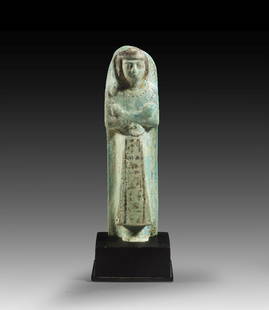Stelenuschebti des Chaemwese, Sohn des Ramses II.: Shabti of Chaemwese, son of Ramses II. New Kingdom, 19th dynasty, ca. 1281 - 1225 BC. Turquoise Faience, H 14.8cm. The costume of the living and the priestly bell characterise the figure as the high