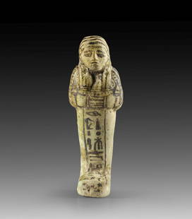 Uschebti des Ramses-em-per-Ra (der biblische Moses?).: Shabti of Ramses-em-per-Ra (the biblical Moses?). New Kingdom, 19th/20th dynasty, reign of Ramses II and Ramses III, ca. 1215-1160 BC. Light green faience, details painted in brown colour. H 11.2cm.