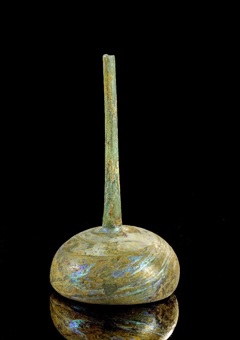 Kugelflasche mit Röhrenhals.: Bottle with hemispherical body and high, slim neck. H 13,7cm. Eastern mediterranean, 4th - 5th century AD. With expertise of Antiken-Kabinett Gackstätter! Spectacular iridescence, chip on tip, small