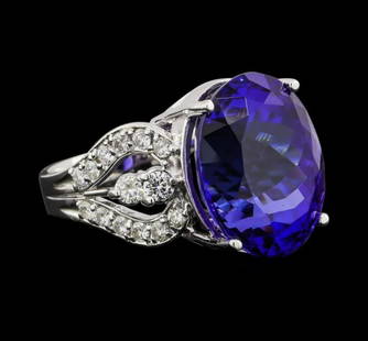 GIA 19.49 ct. Tanzanite & Diamond Ring 14k White Gold: Description:-14KT white gold 12.10 grams Lady's fashion ring with a cathedral split shank with a bright polish finish. The ring has a shank measuring 3.64 millimeters wide. Identified with markings