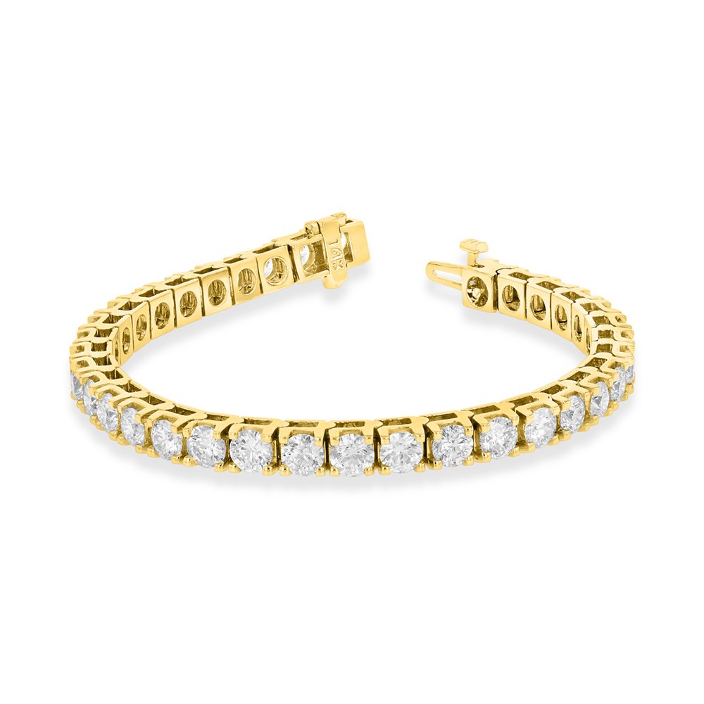 3.00 ct. Round Diamond Tennis Bracelet in 14k Yellow Gold (VS/SI): This 7.0 inch diamond bracelet is in 14K yellow gold. 5.64 Grams. The diamonds have a total carat weight of 3.00 carats. Diamond Specifications- Count: 49 diamonds. Shape: Round. TCW: 3.00 ct. Color: 