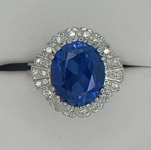 GIA 6.11 ct. No Heat Sapphire & Diamond Ring 14k White Gold: GIA 6.11 ct. Oval Natural Sapphire No Heat. Set in solid 14k white gold 4.57 Grams Size 7.0 Can be resized prior to shipping. 0.84 carats of round diamonds G Color VS-2 Clarity. Total carat weight 6.9