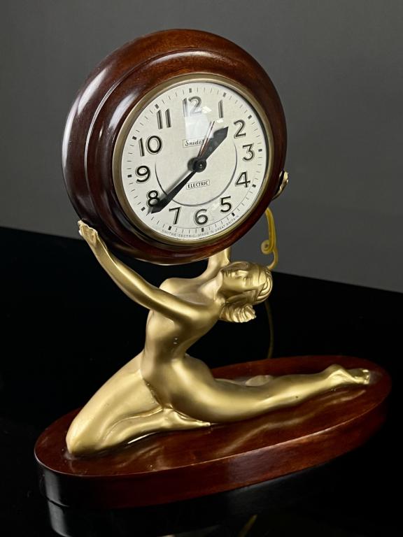 Art Deco Figural Nude Mantel Clock Spelter on wood base. Very good condition. Measures: 12": Spelter on wood base. Very good condition. Measures: 12"