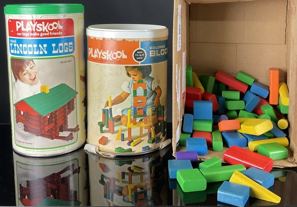 Lincoln Logs & Colored blocks: Block container bottom has been taped and the tape has failed. Blocks shown in box are the contents of that container. Lincoln logs container has pieces placed neatly inside. See detailed photos for a