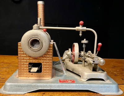 Jensen Style 75 Toy Steam Engine: Wonderful Shape only notible flaw, missing a nut that holds the steam whistle leaver on (Easy Fix) Origina instructions in the chimney, complete with funnel. Measures:12" x 10"