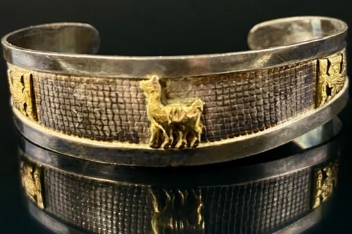 18K Gold & Sterling Cuff Bracelet: 18k Gold and Sterling silver Cuff Bracelet, excellent shape. Measures at its widest opening. 2" x 1/2" . appears to have had a back chain that was removed to fit a larger arm.