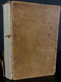 An Antique Plain-Bound Volume, in Worn Leather