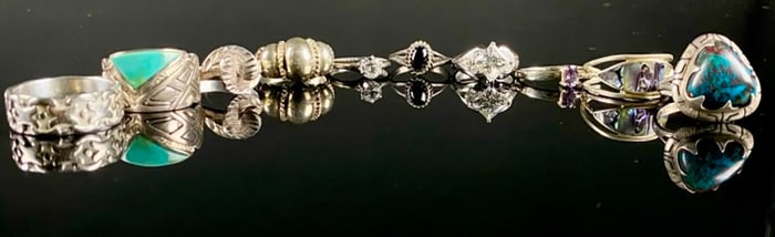A Collection of Ten Diverse Sterling Silver and Silver-Toned Rings with Various Stones