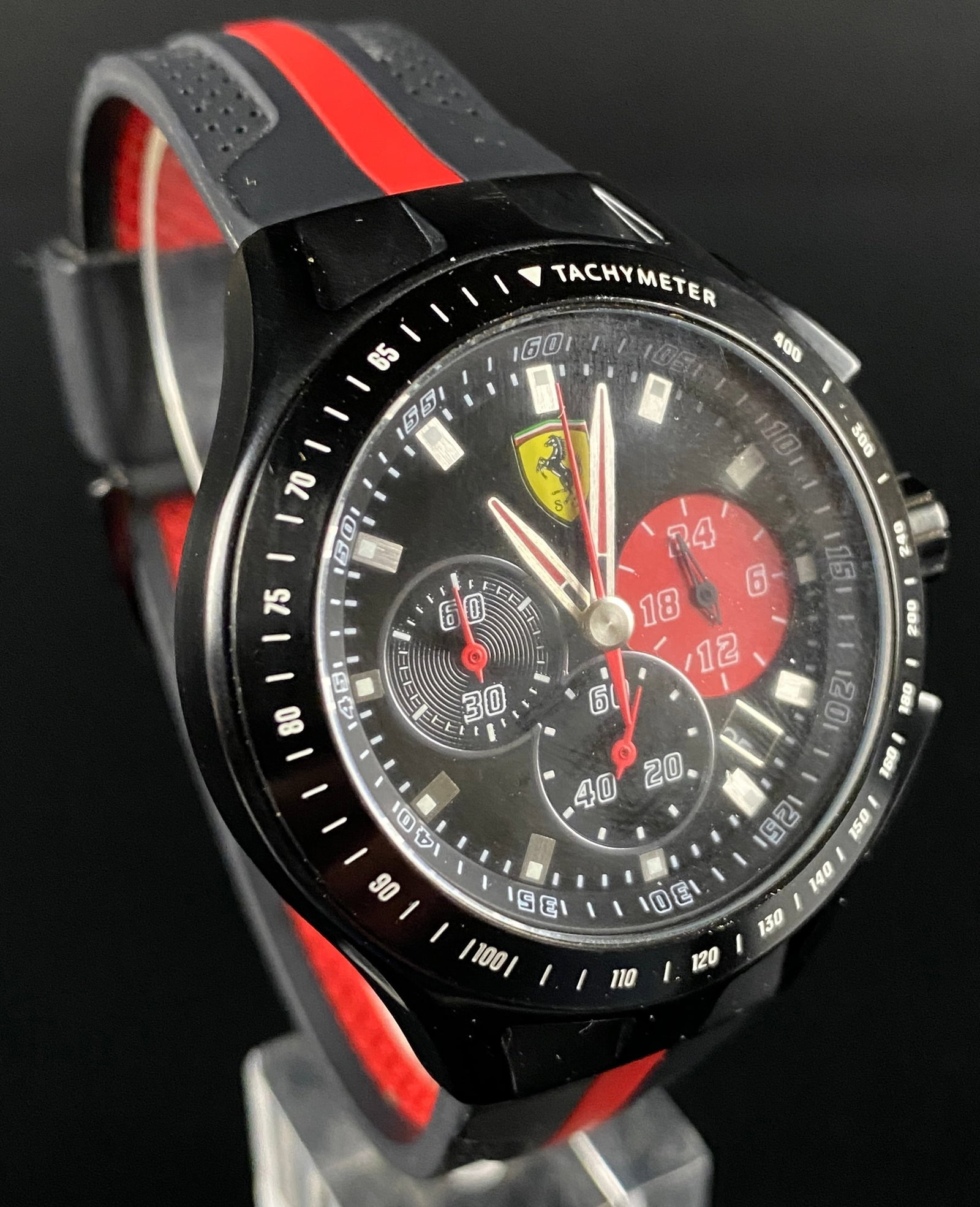 Ferrari Scuderia Race Day Chronograph Quartz Wristwatch, Model SF.03.1.34.0015: A Ferrari Scuderia Race Day Chronograph Quartz Wristwatch, model SF.03.1.34.0015. This modern wristwatch features a black case, likely PVD-coated stainless steel, paired with a black rubber strap acce