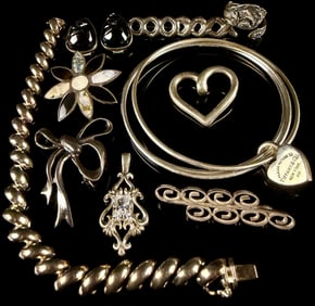 A Collection of Sterling Silver and Silver-Toned Jewelry, including a Tiffany & Co. Bangle 2.5 Ozt