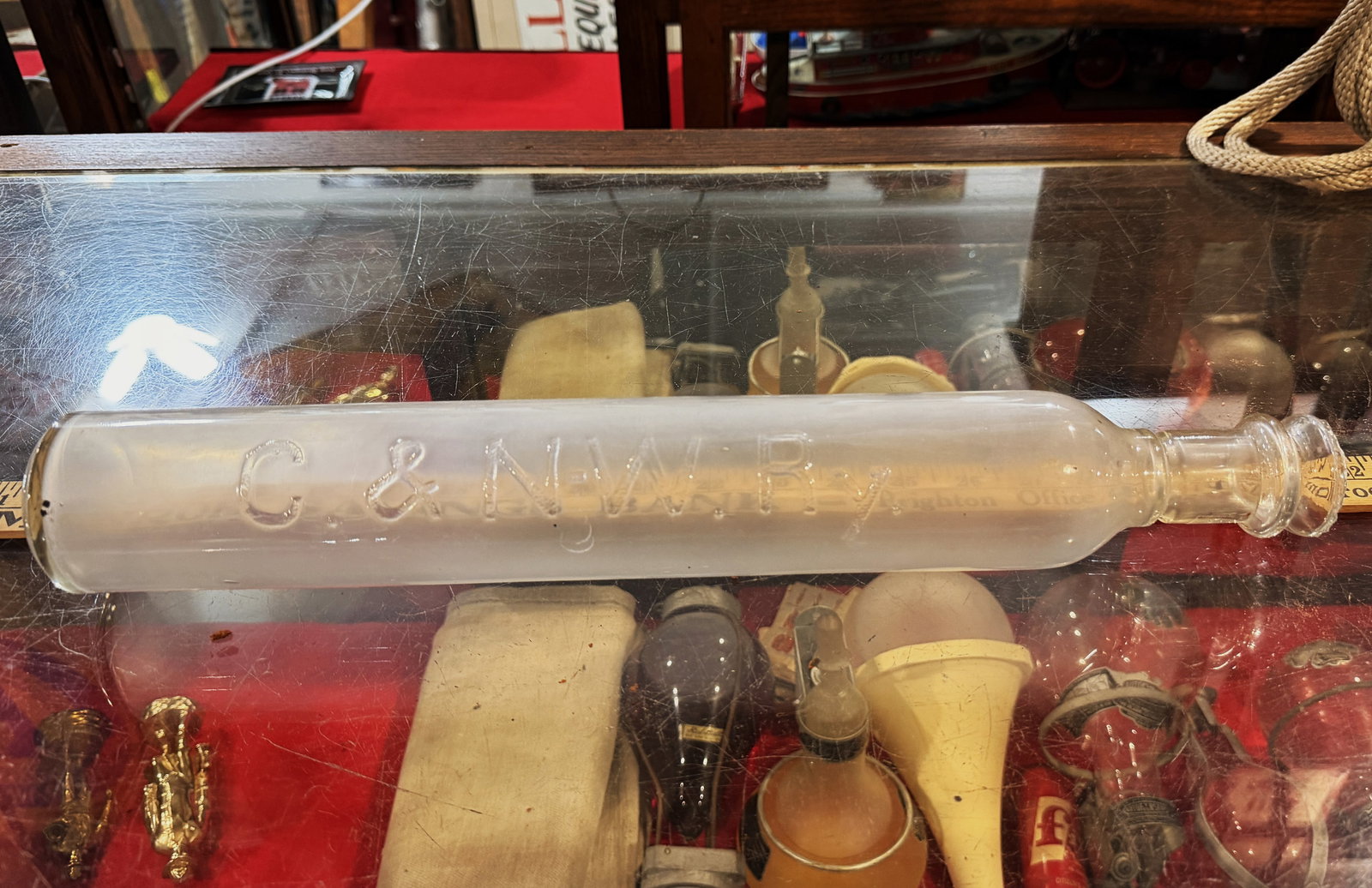 C & N.W.R.Y. Chicago Northwestern Railroad Glass Fire Extinguisher Bottle: This is a rare glass fire extinguisher bottle, originally associated with the C & N.W.R.Y. (Chicago Northwestern Railroad) Crafted from milky white or opalescent glass, the long cylindrical bottle