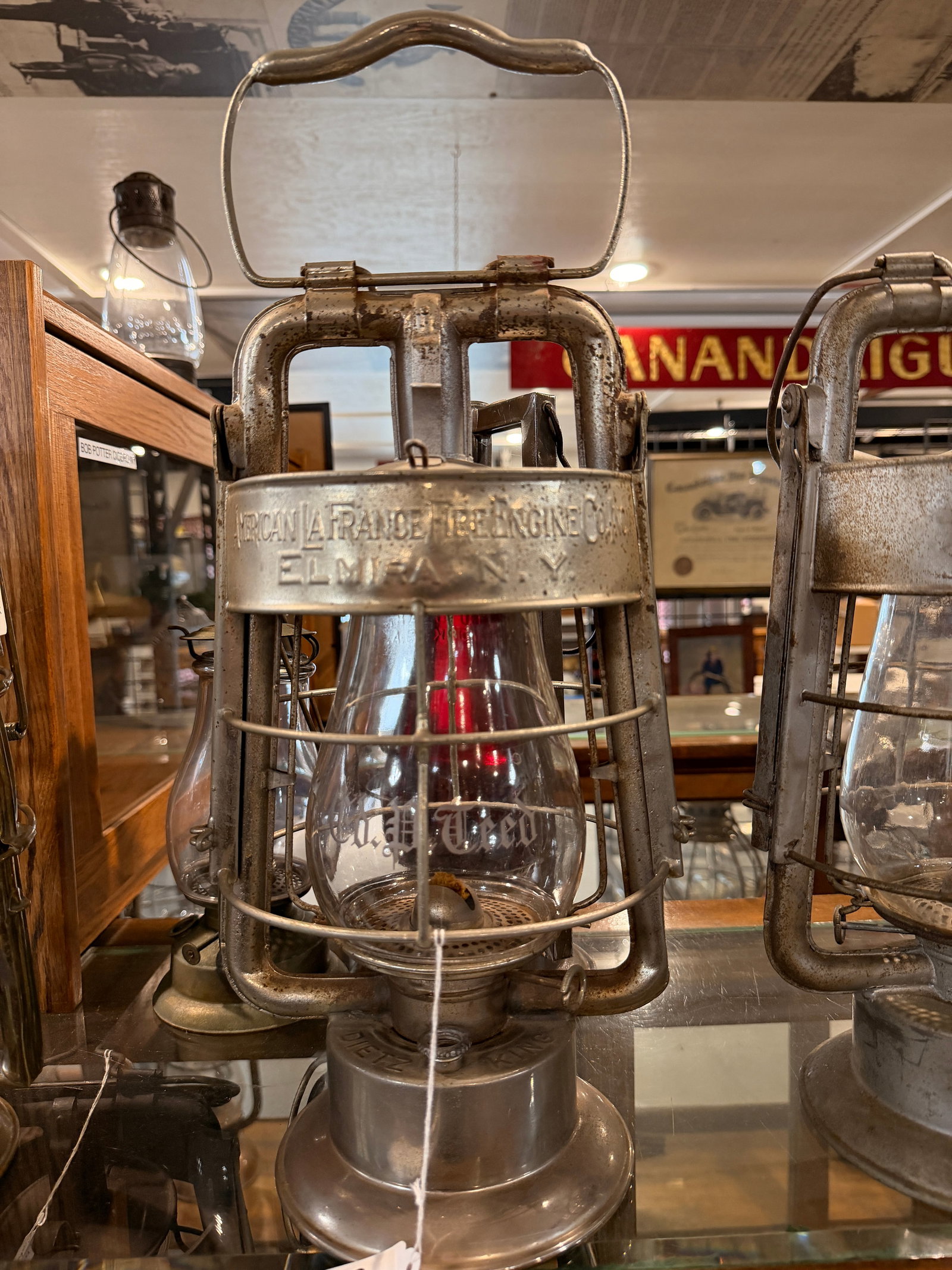 American LaFrance Fire Engine Co. Dietz King Lantern Etched Globe: Etched Globe "W.H. Tweed" Dated 1907, An American LaFrance Fire Engine Co. Dietz King lantern, constructed primarily of steel or galvanized iron with a clear glass globe, likely dating to the early