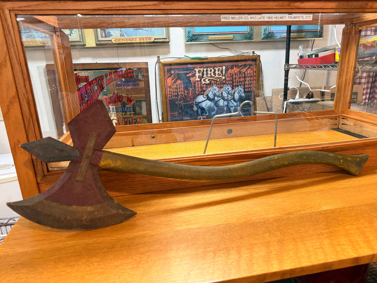 Antique Fireman's Parade Axe: An Antique Fireman's Parade Axe, likely dating from the late 19th or early 20th century. This oversized, decorative double-headed axe features two distinct, non-sharpened blades â€“ one broad