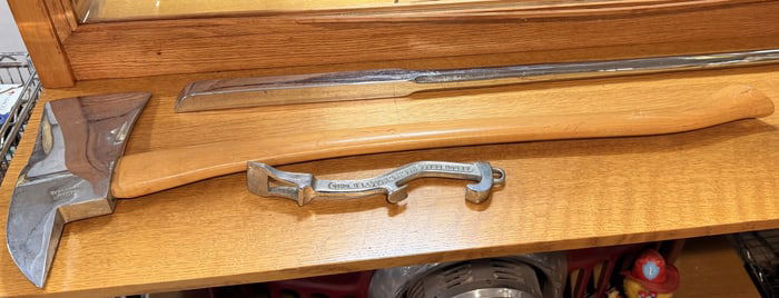 A Mann Lewistown Fireman's Axe, Chrome Pry Bar, and Akron Brass Fire Hose Spanner Wrench
