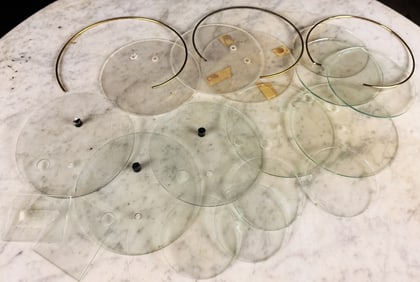 Several pieces of round glass for Early Gamewell Interior Alarm boxes