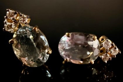 14KT Yellow Gold Stud Earrings Featuring Oval Pale Blue Gemstones and Diamond Accents Category: