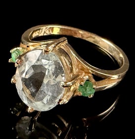 14K Yellow Gold Ring Featuring Large Pale Faceted Gemstone and Green Accents