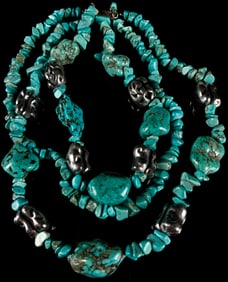 Silver-Toned Multi-Strand Necklace Featuring Chunky Irregular Turquoise Nuggets Category: Necklaces