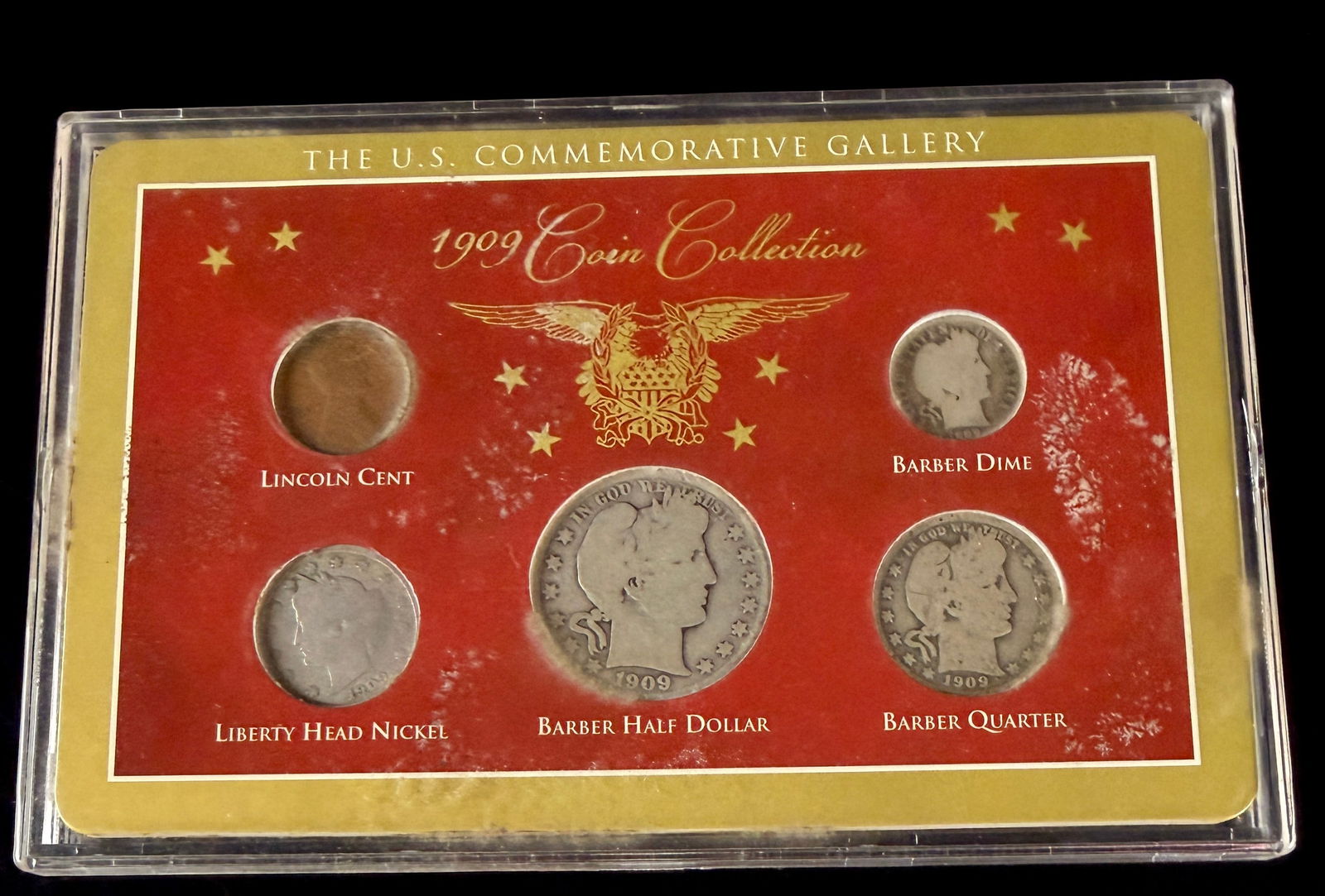 The U.S. Commemorative Gallery 1909 Coin Collection: A set of five United States coins from the year 1909, issued by The U.S. Commemorative Gallery. The collection includes a Lincoln cent, a Liberty Head nickel, and Barber design silver coinage consisti