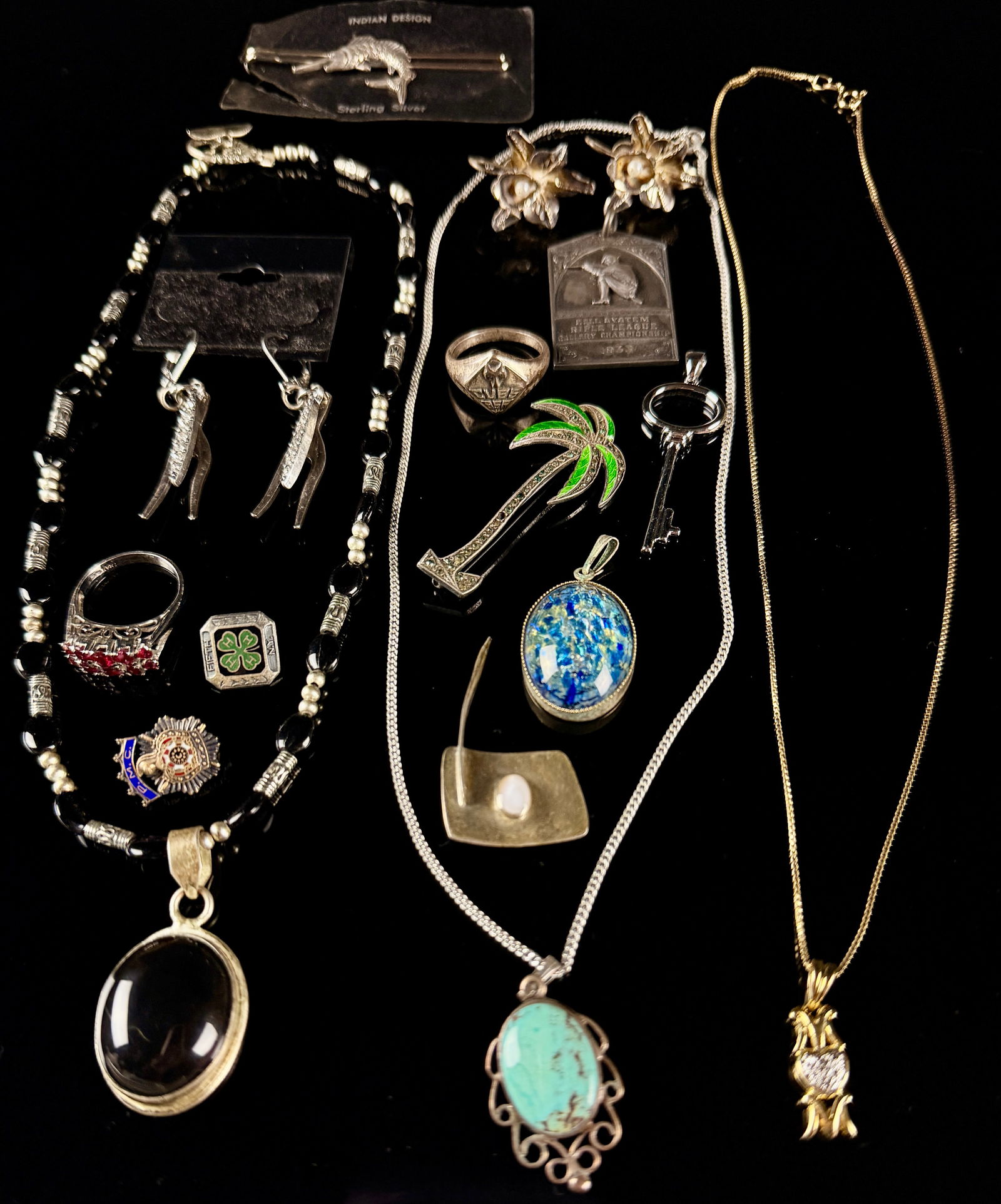 A Collection of Sterling Silver and Assorted Estate Jewelry: A collection of assorted jewelry and small collectibles featuring various styles ranging from the early 20th century to contemporary designs. Notable items include a 1933 sterling silver Bell System R