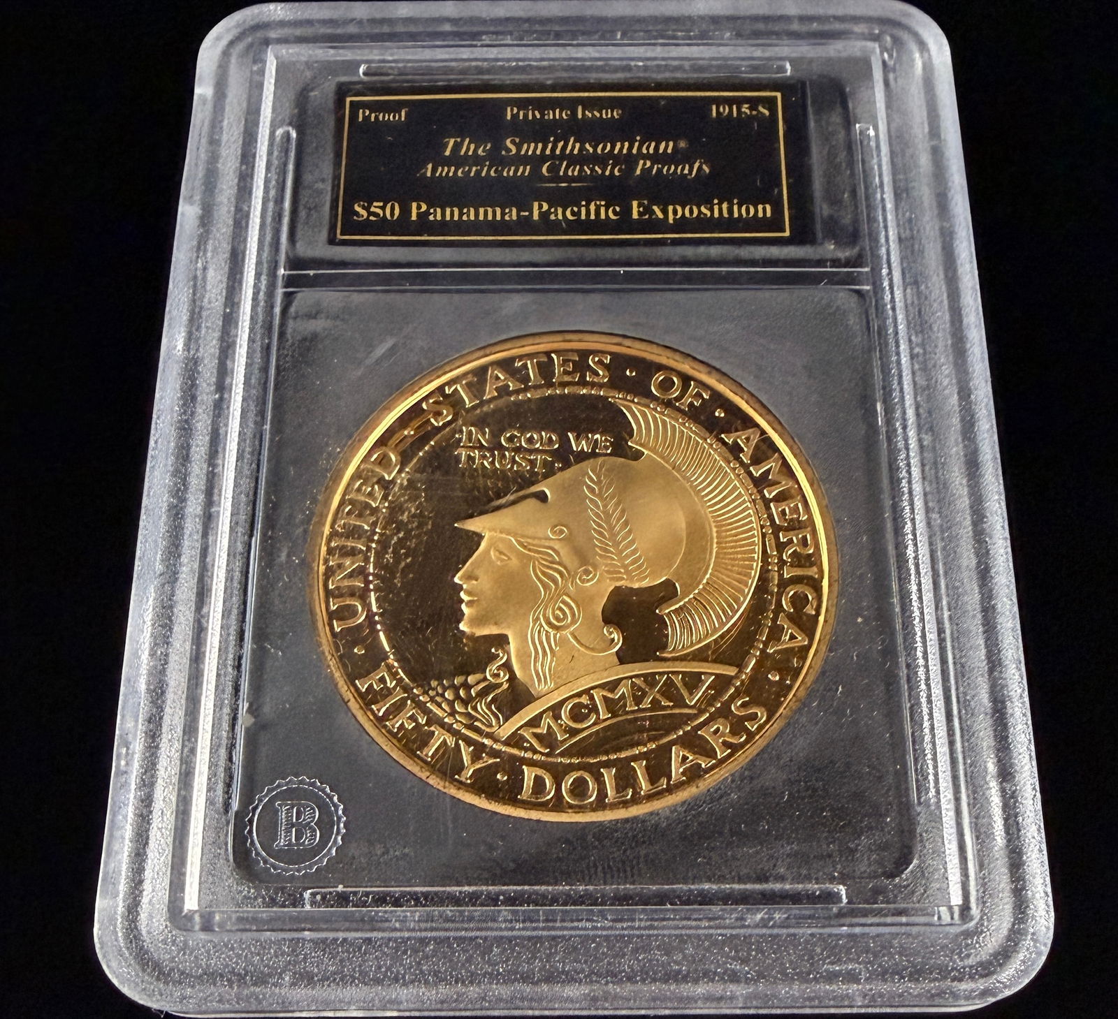 Smithsonian American Classic Proofs Fifty Dollar Panama-Pacific Exposition Private Issue Tribute: A private issue proof round from The Smithsonian American Classic Proofs series, modeled after the 1915-S Panama-Pacific Exposition fifty dollar commemorative. Struck in a gold-toned metal, the obvers