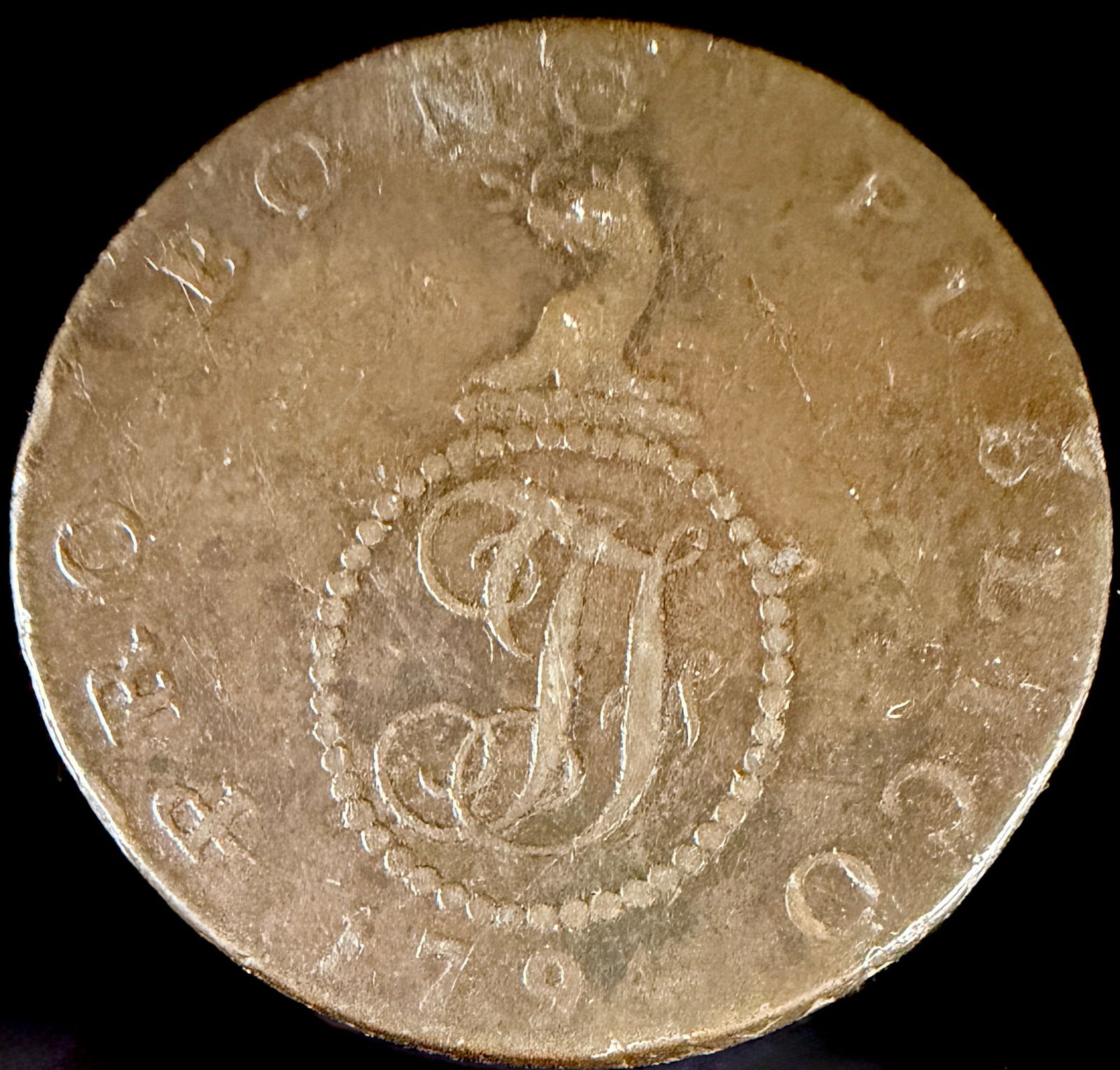 1794 Suffolk Haverhill Halfpenny Token John Fincham: A 1794 British provincial halfpenny token from Haverhill, Suffolk, issued by John Fincham. Struck in copper alloy, the obverse features a script cypher within a beaded circle, surmounted by a leopard