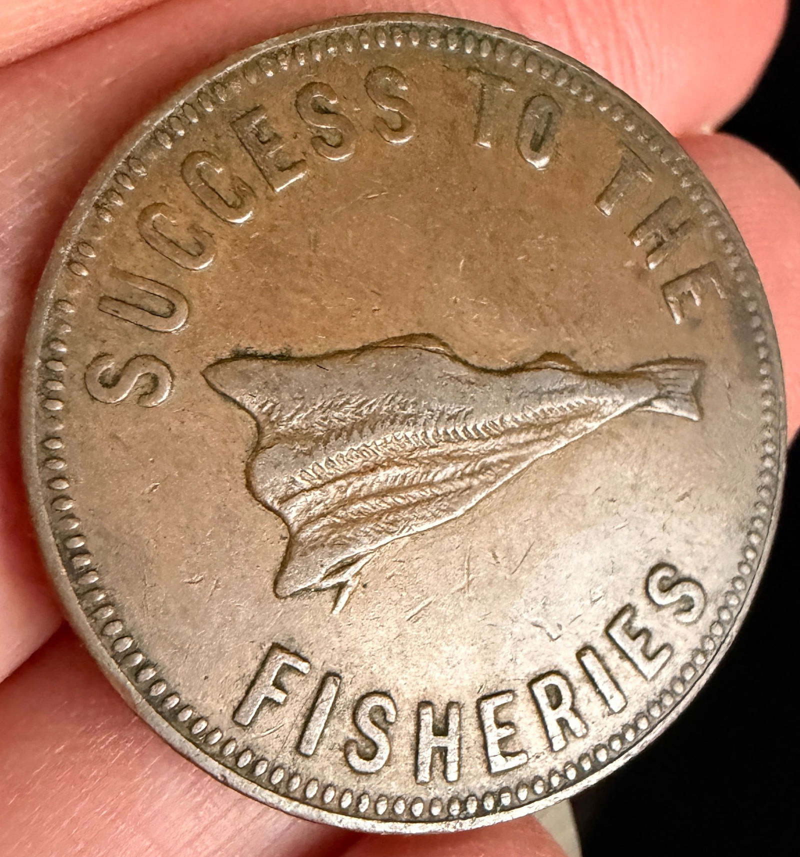 Prince Edward Island 1860 Success to the Fisheries Speed the Plough One Cent Token: A Prince Edward Island copper alloy trade token, typically dated to 1859 or 1860. The obverse features the inscription SUCCESS TO THE FISHERIES surrounding a central motif of a dried cod. The reverse
