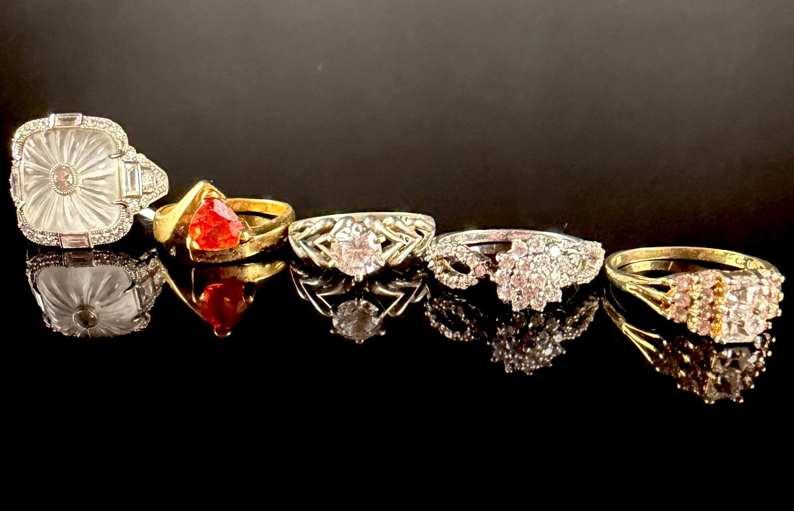 A Collection of Sterling Silver and Gold-Tone Gemstone Rings including Camrose and Kross: This collection features an assortment of rings in various styles and materials. Included is a sterling silver ring marked JBK 925, identifying it as a Camrose and Kross reproduction from the Jacqueli