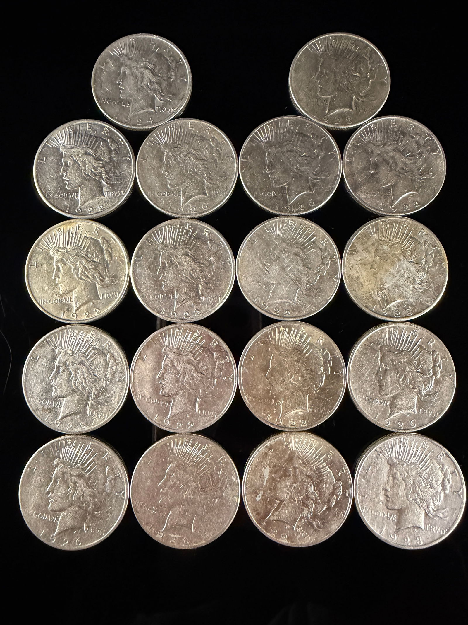 A Collection of United States Peace Silver Dollars: A collection of United States Peace Dollar silver coins minted between 1922 and 1928. (8) S Mint Mark, 2 D Mint Mark. Struck in 90 percent silver, these coins feature the design by Anthony de