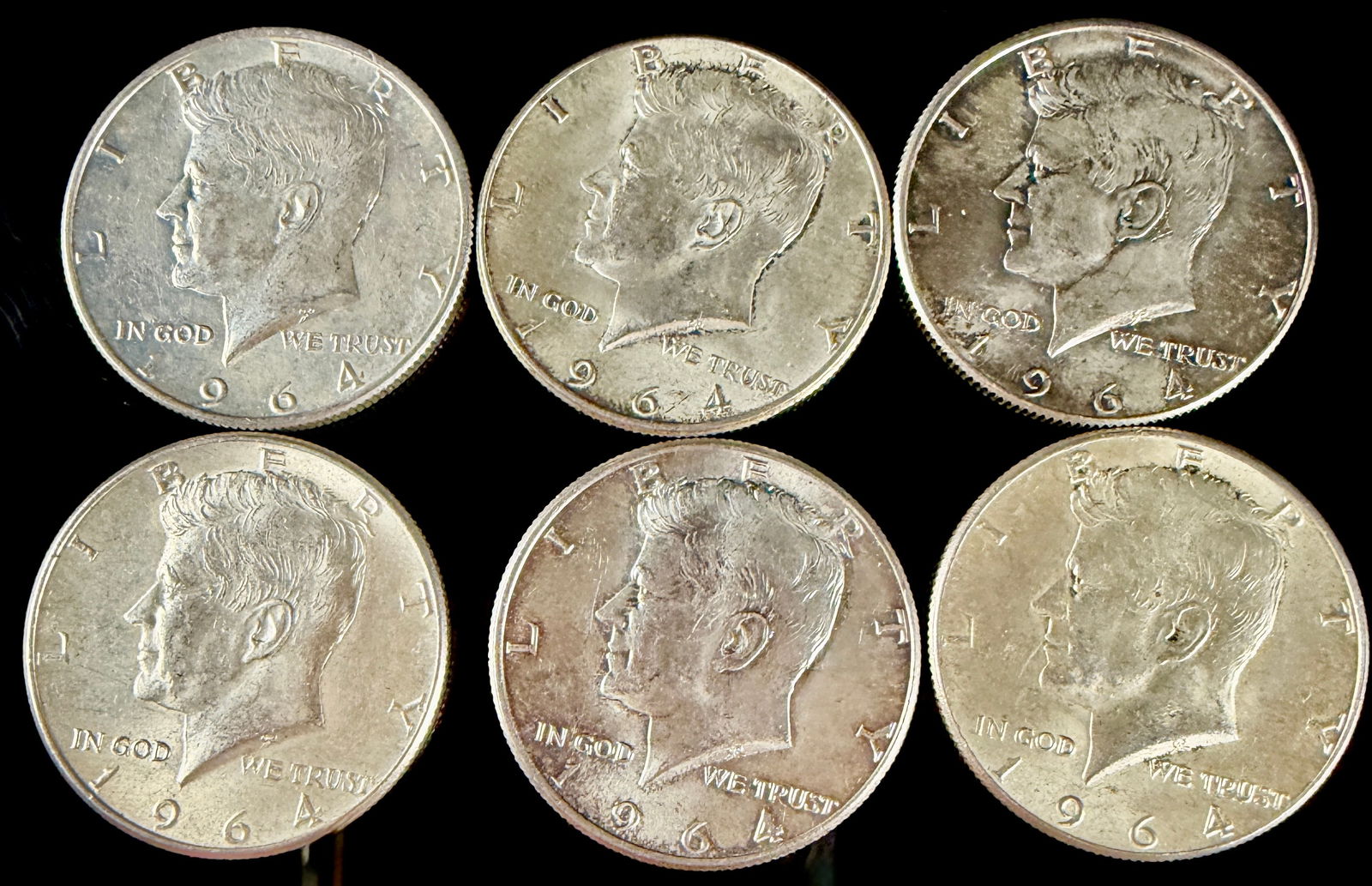 A Group of 1964 Kennedy Half Dollars: A group of Kennedy half dollars struck in 1964. Each coin is composed of 90 percent silver. The obverse features a left-facing portrait of President John F. Kennedy with the inscription LIBERTY along