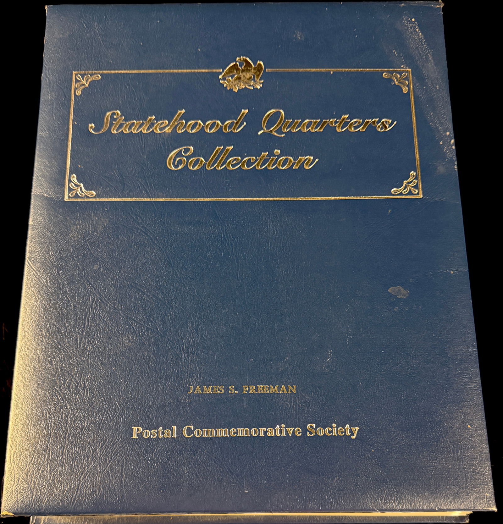 Postal Commemorative Society Statehood Quarters Collection: 24 pages in total , with 2 coins per each. This Postal Commemorative Society Statehood Quarters Collection is housed in a large blue textured binder featuring gold-tone foil stamping and decorative