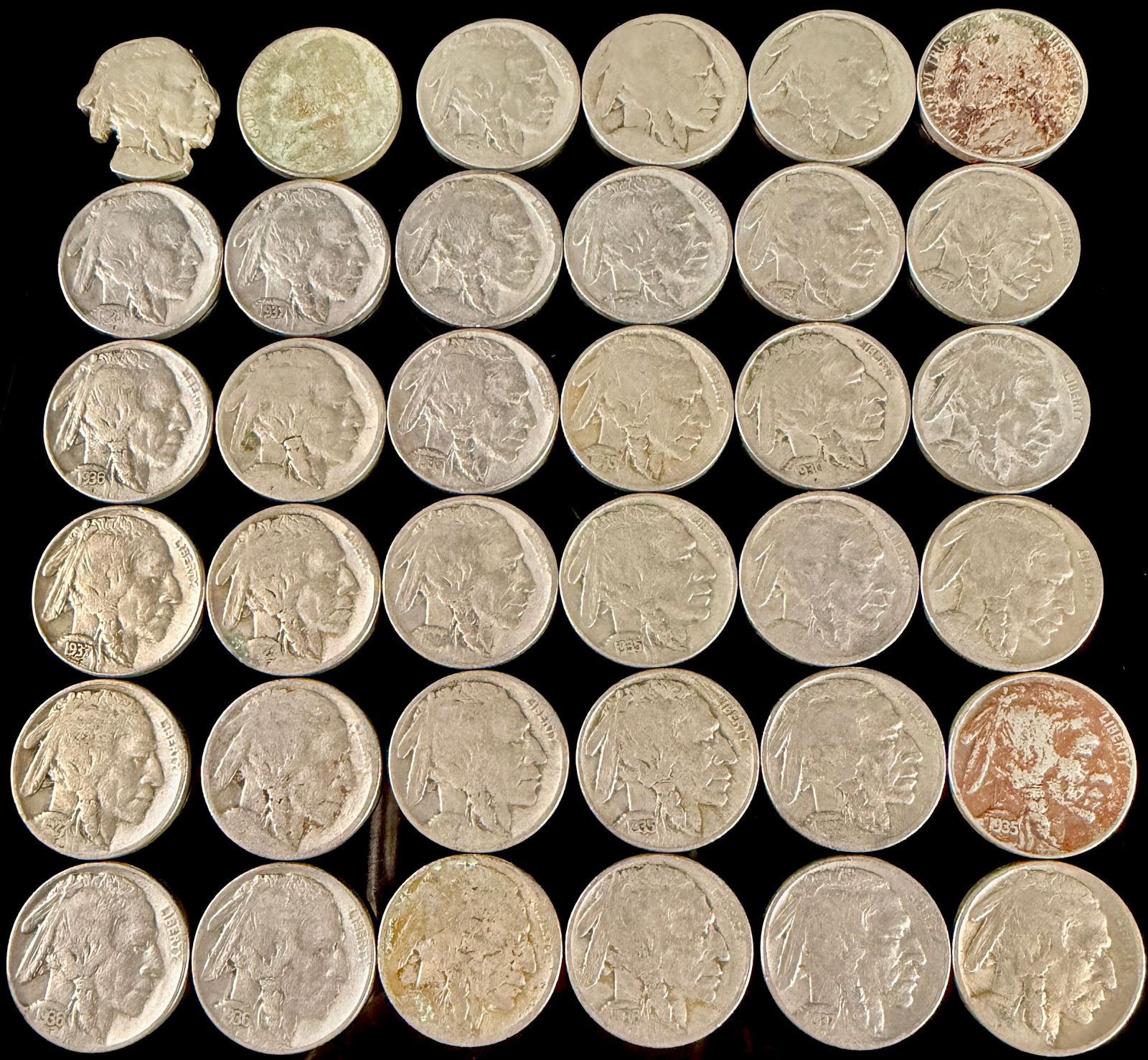 A Collection of United States Buffalo Nickels: This collection of United States five-cent coins primarily features the Buffalo, or Indian Head, design minted between 1913 and 1938. The specimens are composed of copper-nickel and feature the profil