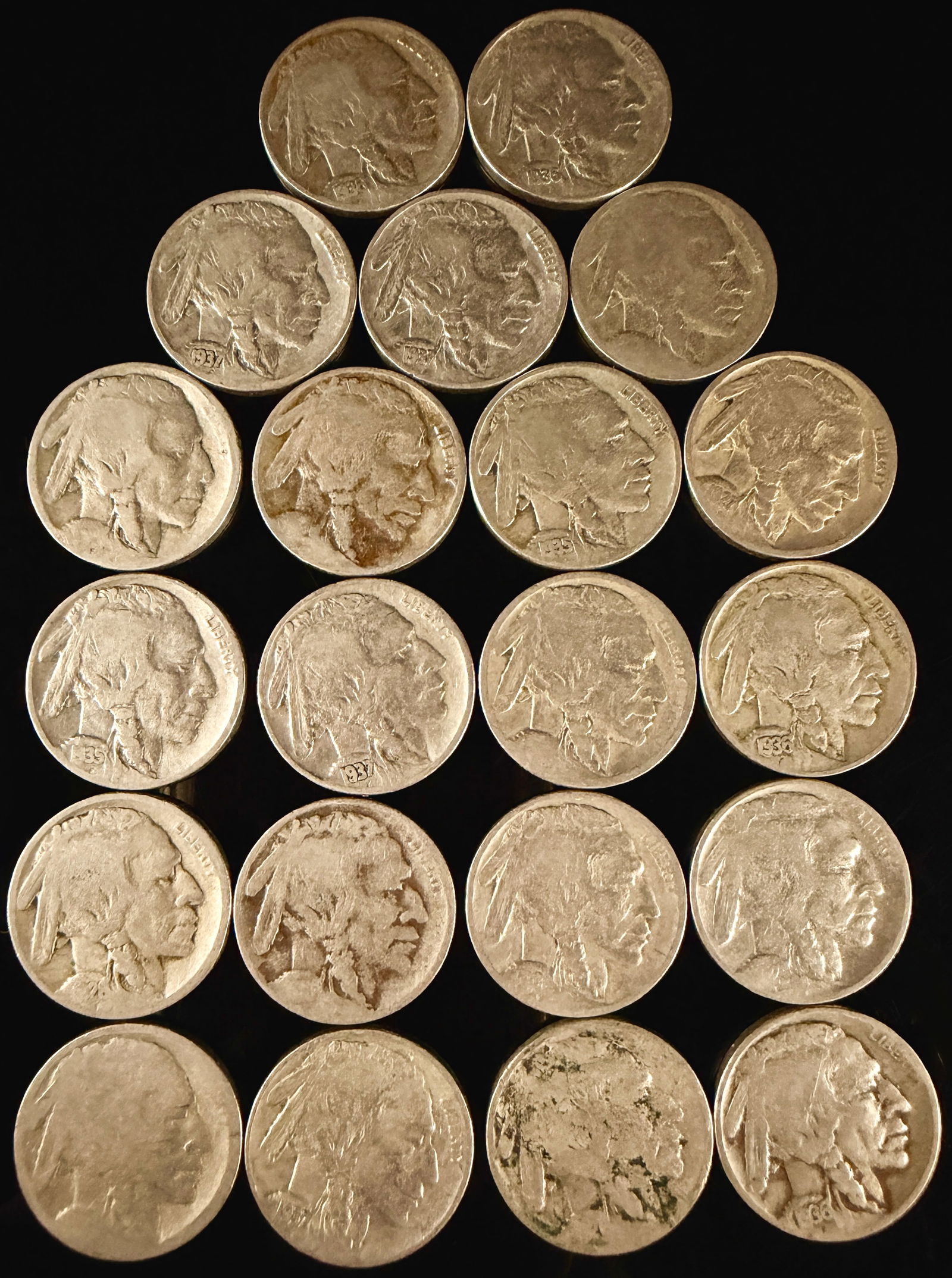 A Collection of United States Buffalo Nickels: A collection of United States Buffalo nickels, also known as Indian Head nickels, primarily dating from the mid-1930s. Struck in a copper-nickel alloy, each coin features the obverse profile of a Nati