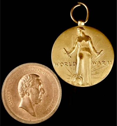 Two United States Medallions Including a World War II Victory Medal and a Millard Fillmore: Two United States medallions comprising a World War II Victory Medal and a Millard Fillmore Indian Peace Medal commemorative. The World War II Victory Medal is a gold-toned circular medallion