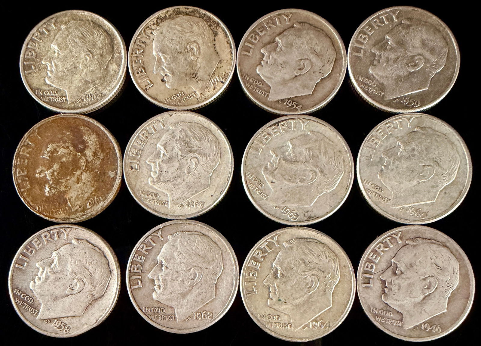 A Collection of United States Roosevelt Silver Dimes, 1946-1964: A collection of United States Roosevelt dimes minted between 1946 and 1964. Each coin is struck in 90 percent silver. The obverse design features the profile of President Franklin D. Roosevelt with th