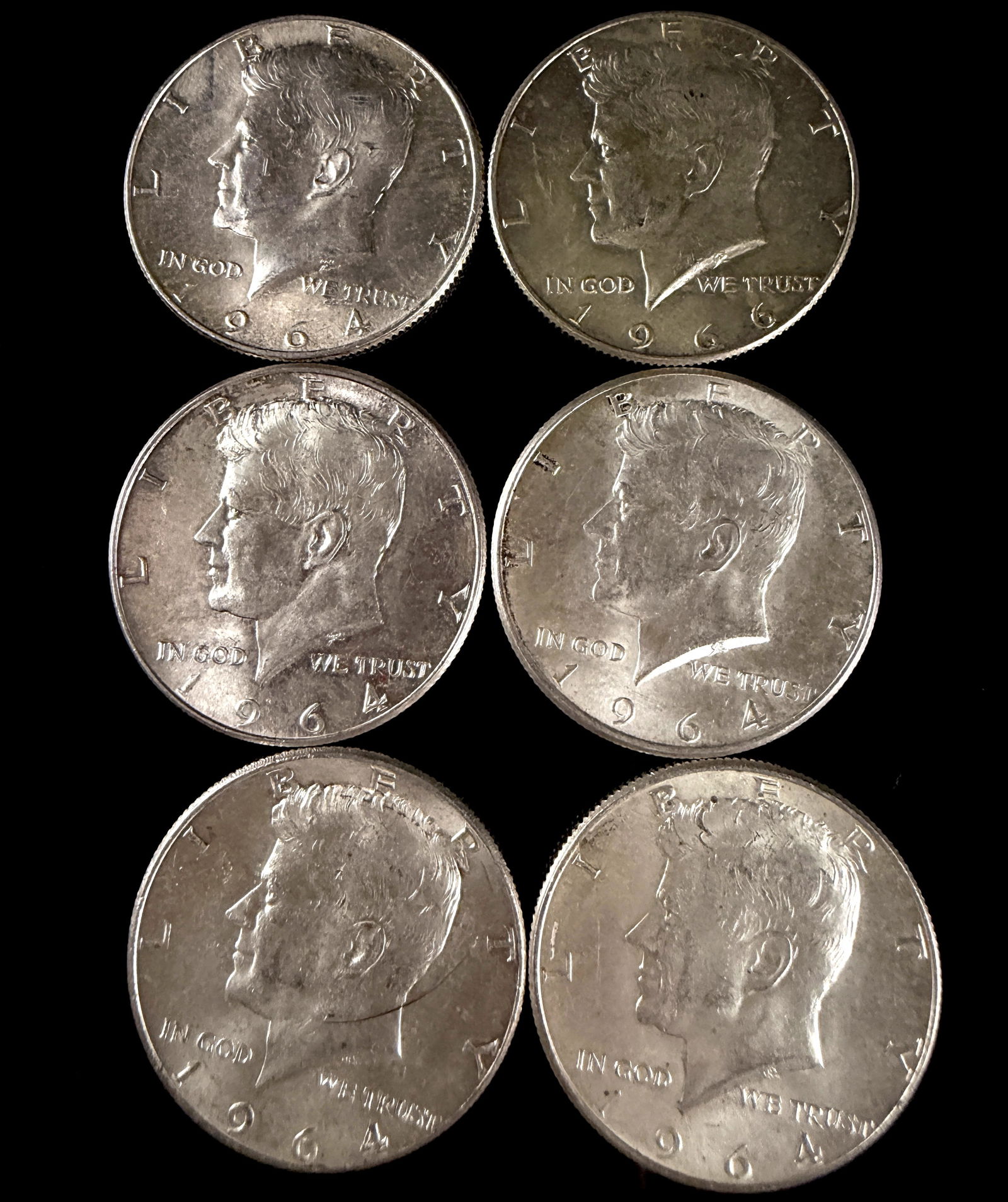 A Collection of United States Kennedy Silver Half Dollars: A collection of United States Kennedy Half Dollars comprising examples dated 1964 and 1966. Struck in silver, the obverse of each coin features the left-facing profile of President John F. Kennedy wit