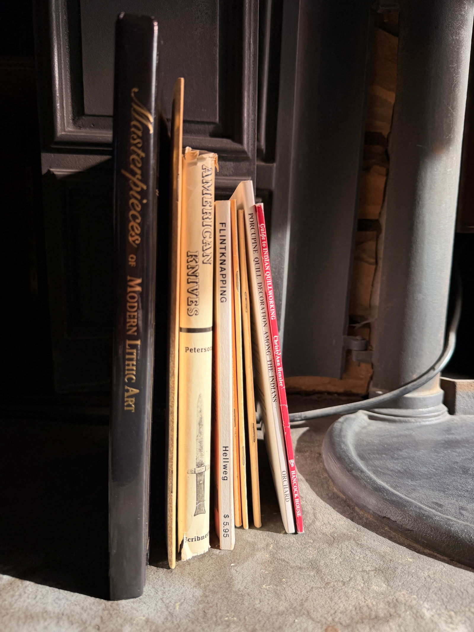 A Collection of Books and Catalogs Relating to Native American Crafts, Lithic Art, and Outdoor: A collection of softcover and hardcover publications primarily focused on Native American craft techniques, lithic art, and vintage outdoor supplies. A primary highlight is a copy of Masterpieces of M