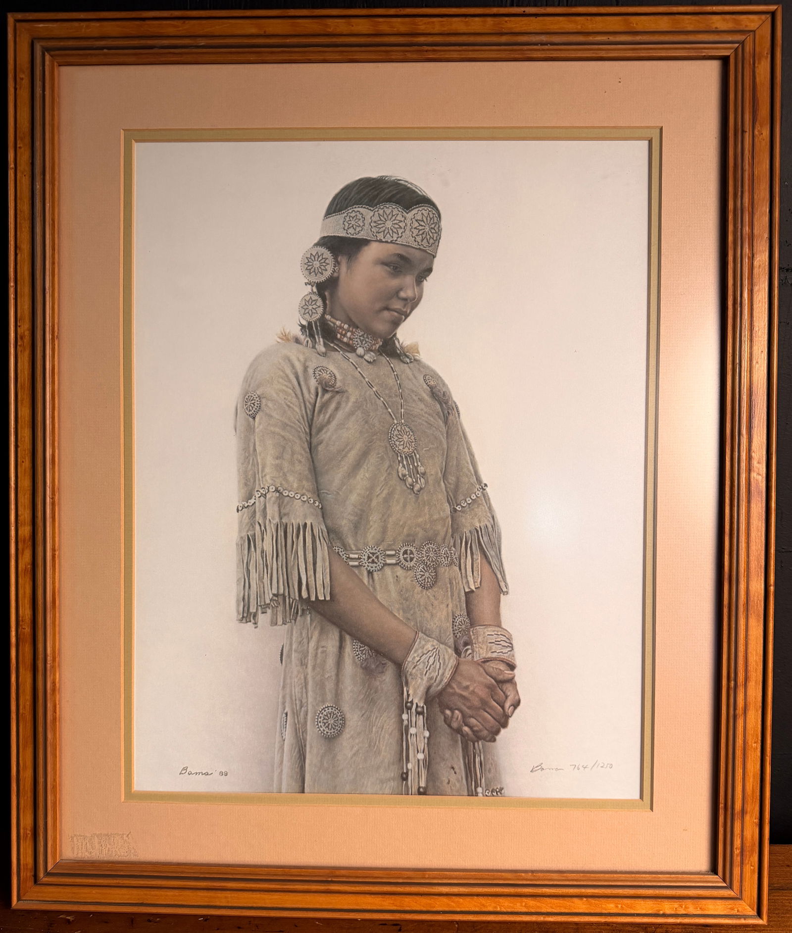 James Bama Little Fawn Cree Indian Girl Signed and Numbered Limited Edition Lithograph: A limited edition lithograph titled Little Fawn - Cree Indian Girl by artist James Bama (American, 1926-2022), dated 1989. The work is a realistic portrait of a young girl wearing traditional fringed